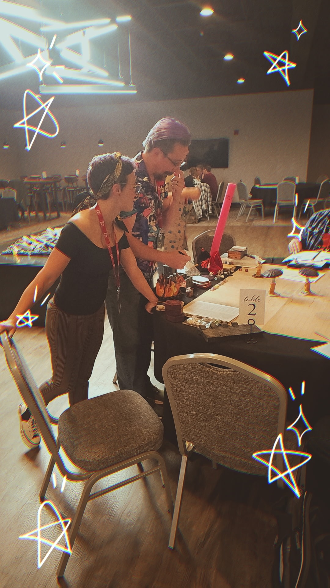 Two players reviewing the game at a convention table